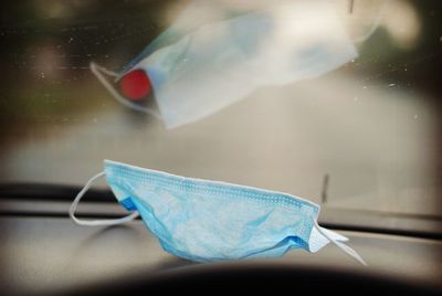 Close-up of blue car on window