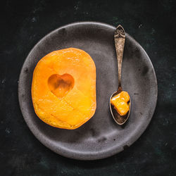 Close-up high angle view of mango in plate