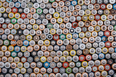 Used batteries from different manufacturers,  collection and recycling, danger for the environment. 