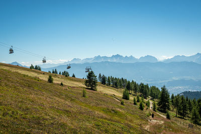 Scenic view of mountains against clear blue sky