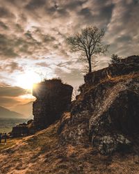 Scenic view of rock formation against sky during sunset