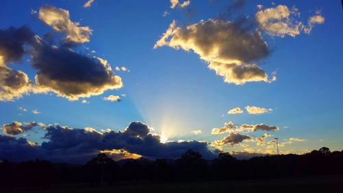 Scenic view of landscape against cloudy sky