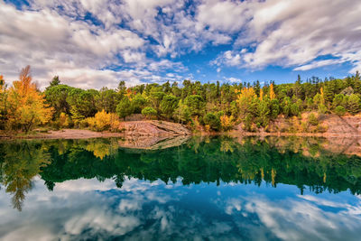 Scenic view of mirror like reflection of carces lake in south of france in autumn colors 