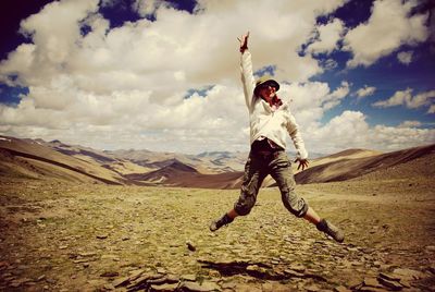 Woman jumping in sky