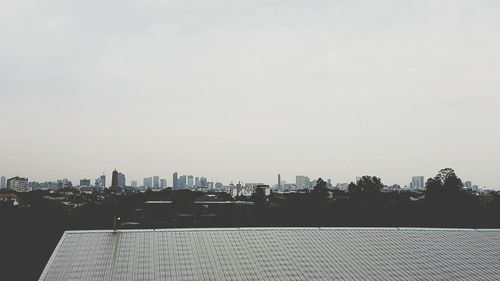 Modern cityscape against clear sky