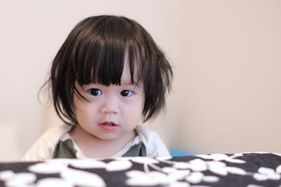 Close-up of cute girl at home