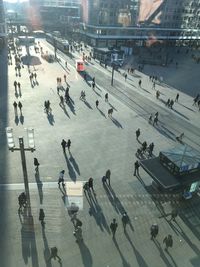 High angle view of people walking on street in city