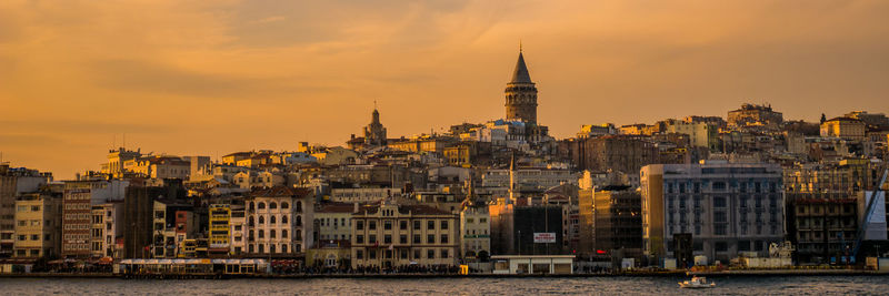 View of buildings against sky at sunset