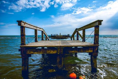 Pier over sea against sky