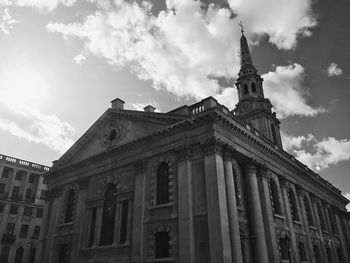 Low angle view of building against cloudy sky