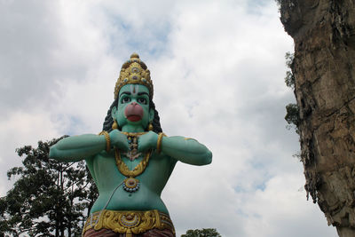 Low angle view of statue against sky