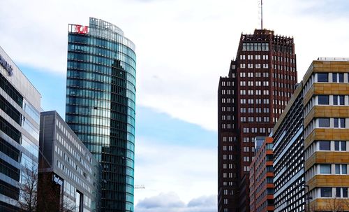 Low angle view of modern buildings against sky