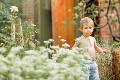 Portrait of shirtless boy looking away