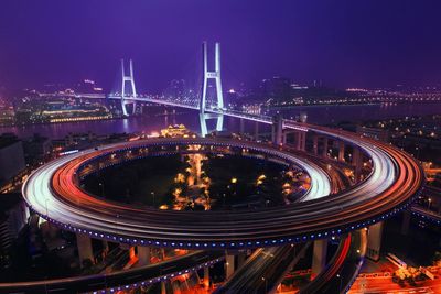 High angle view of light trails on elevated road at night