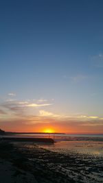 Scenic view of calm sea at sunset