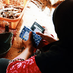 High angle view of woman using mobile phone