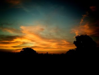 Scenic view of dramatic sky during sunset