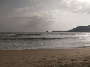 Scenic view of beach and sea against sky