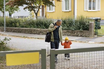 Father walking with child