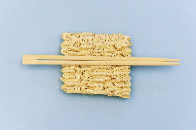 High angle view of bread on table against white background