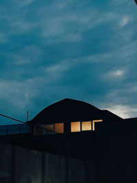 Low angle view of building against sky during sunset