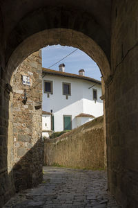 Alley amidst buildings in city