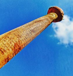 Low angle view of metallic structure against blue sky