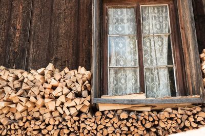 Heap of firewood by window