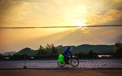 People riding bicycle on road