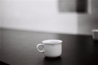 Close-up of coffee cup on table