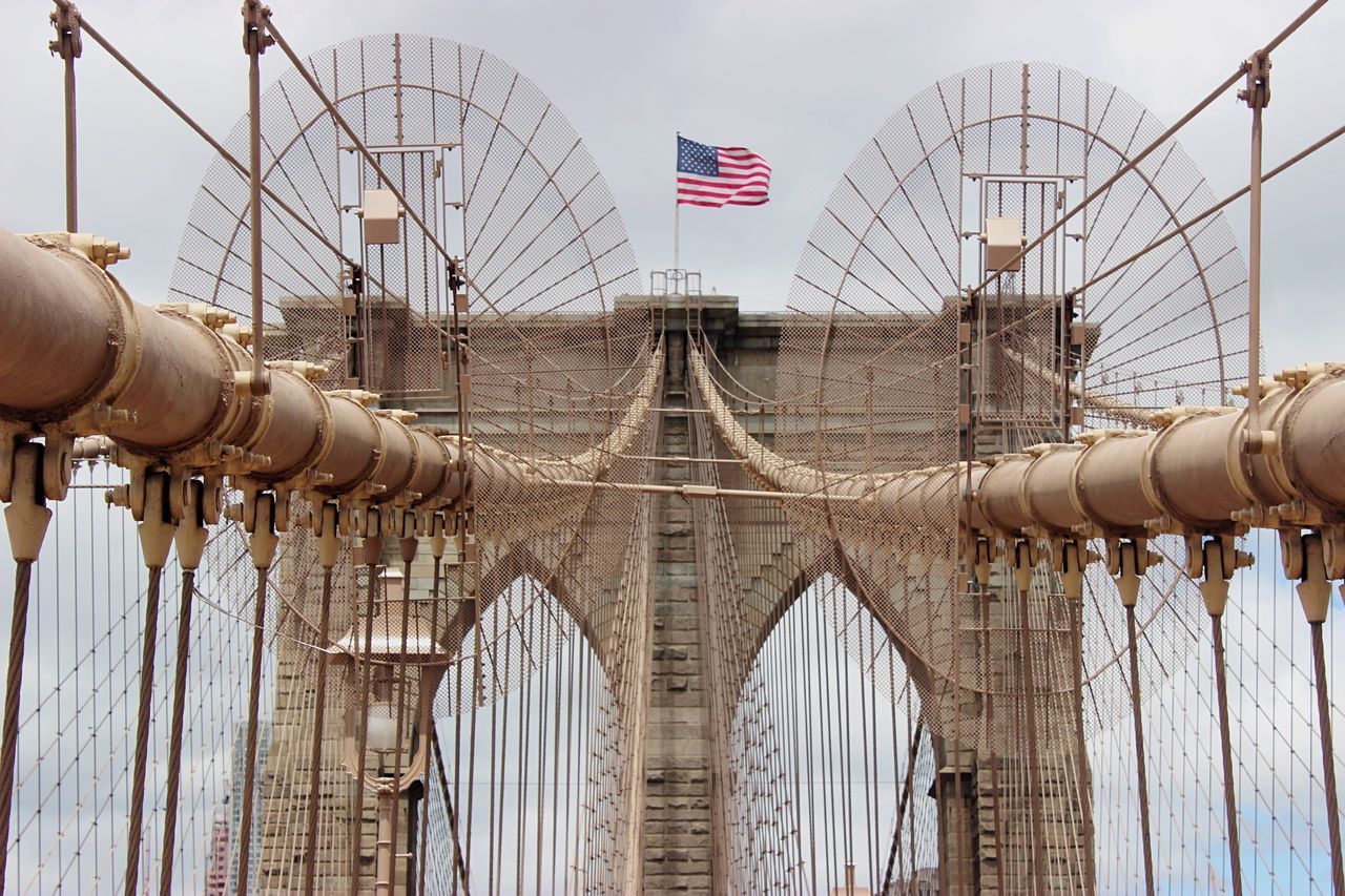 connection, built structure, architecture, engineering, suspension bridge, metal, low angle view, famous place, bridge - man made structure, international landmark, travel destinations, steel cable, sky, metallic, tourism, brooklyn bridge, cable-stayed bridge, cable, golden gate bridge, travel
