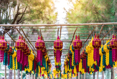 Close-up of multi colored lanterns hanging in row