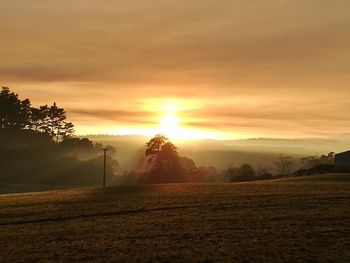 Scenic view of landscape against sky during sunset