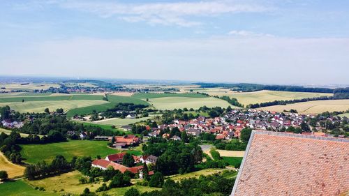 High angle view of town against cloudy sky