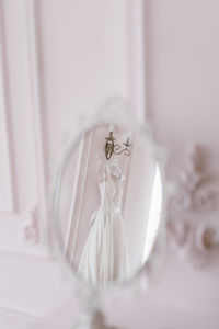 Close-up of wedding rings on table at home