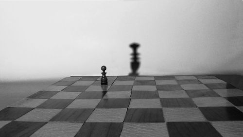 Full frame shot of chess pieces against clear sky