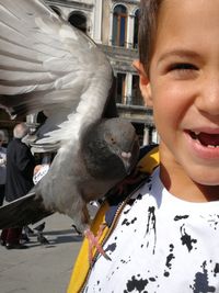 Portrait of boy in bird