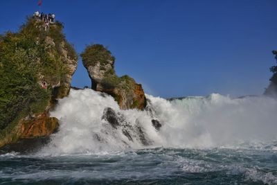 Scenic view of sea against clear blue sky