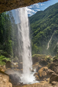 View from behind pericnik waterfall in the julian alps, slovenia