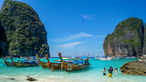 Boats in sea against sky