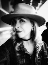 Portrait of young woman wearing hat