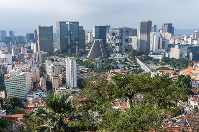 High angle view of trees and buildings in city