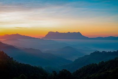 Scenic view of mountains against sky during sunset