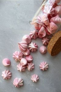 High angle view of pink flower meringues  on table