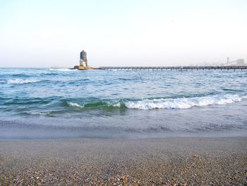 Scenic view of sea against clear sky