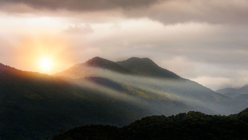 Scenic view of mountains against sky during sunset