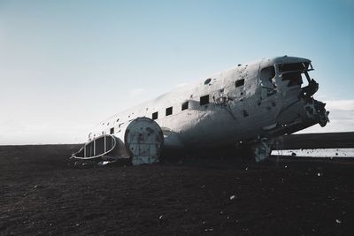 View of abandoned airplane in iceland against sky