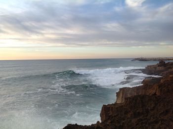 Scenic view of sea against dramatic sky