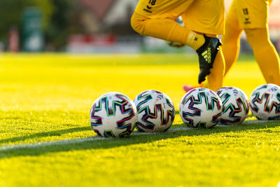 Close-up of yellow ball on grassland