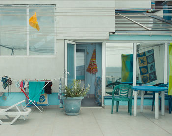 Chairs and tables against wall